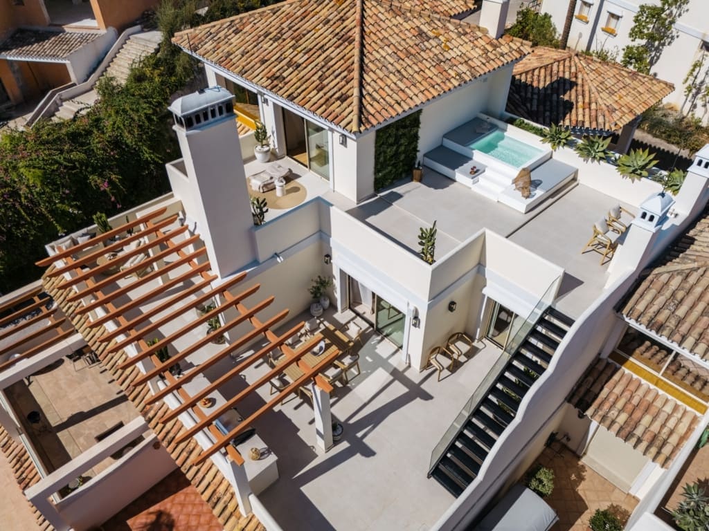 default | MDR Luxury Homes Stunning panoramic view of Maison Fuzei, a fully renovated luxury duplex penthouse in Nueva Andalucía, featuring modern design, private pool, and exclusive amenities - presented by MDR Luxury Homes.