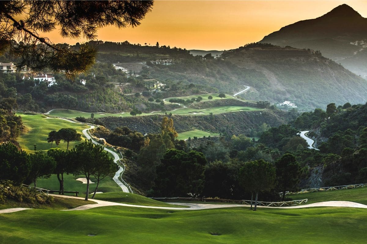 A breathtaking view of La Zagaleta, showcasing its luxurious villas, golf courses, equestrian facilities, and pristine natural surroundings in the hills of Benahavís, Costa del Sol.