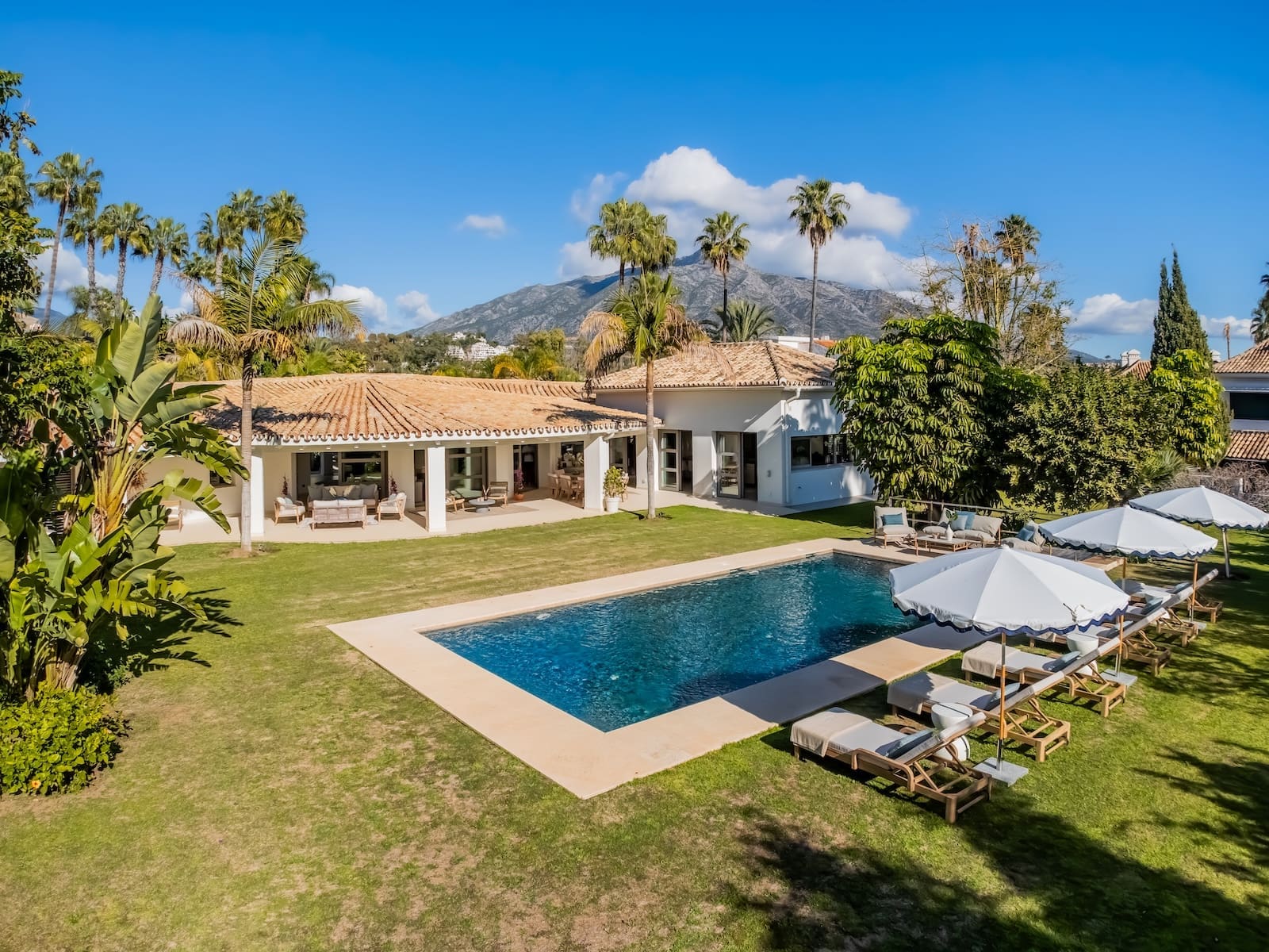 Villa Palm Springs in La Cerquilla, Marbella – luxury bungalow with botanical gardens and pool, listed by MDR Luxury Homes.