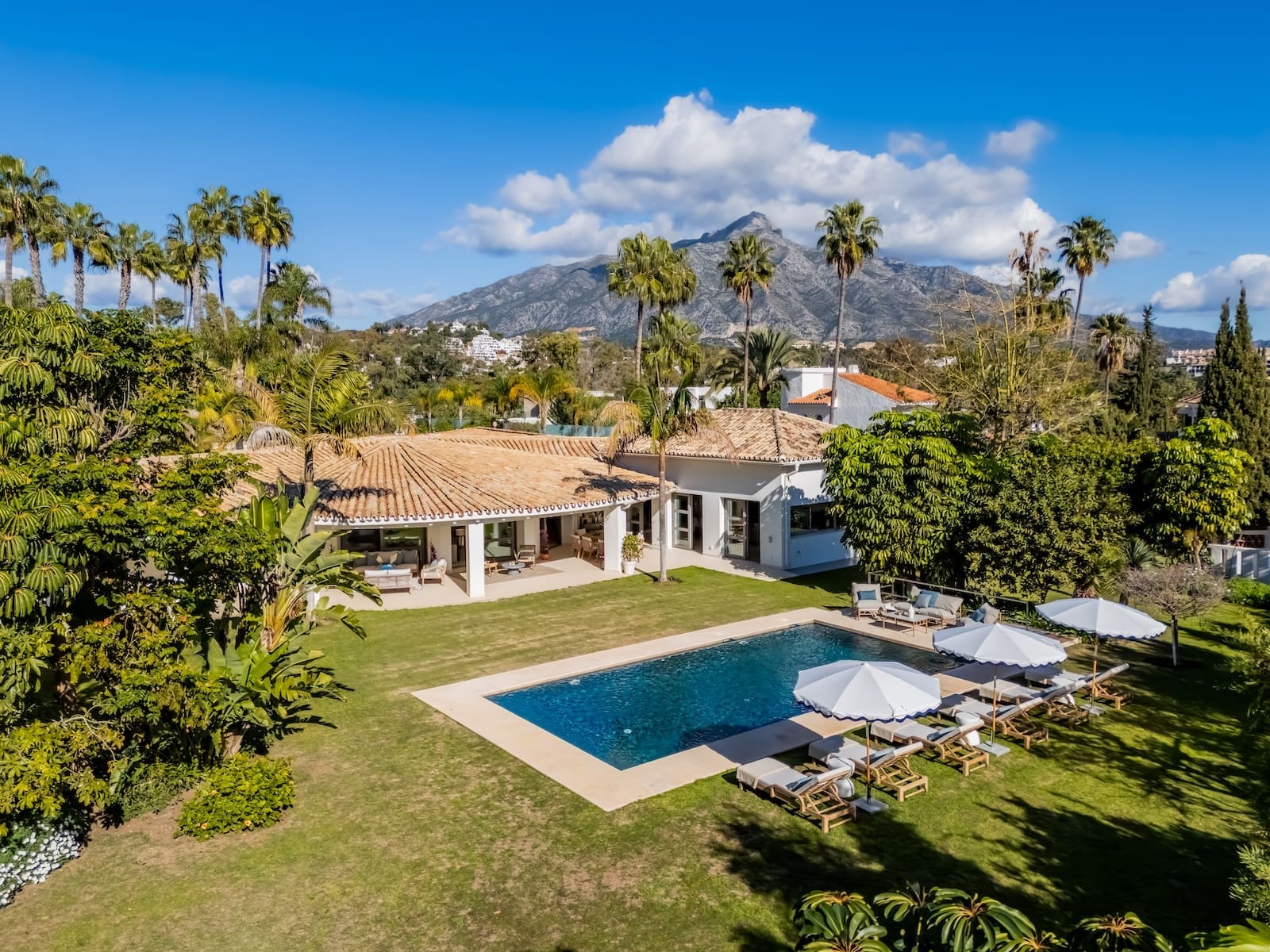 Villa Palm Springs in La Cerquilla, Marbella – luxury bungalow with botanical gardens and pool, listed by MDR Luxury Homes.