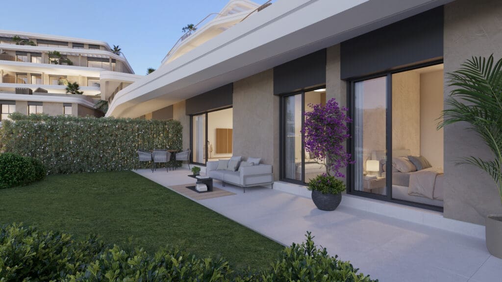 Modern patio with beige sofa seating on a concrete terrace, large glass doors, and a potted purple flowering plant nearby.