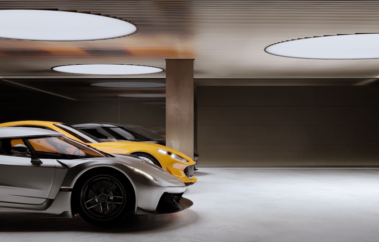 Two sports cars—silver and yellow—parked in a modern underground garage with round ceiling lights and a concrete column nearby.